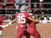 Washington State wide receiver Joey Hobert, right, celebrates as he runs for a touchdown, with wide receiver Lincoln Victor, a Union High grad, during the second half against Oregon State, Saturday, Oct. 9, 2021, in Pullman. Washington State won 31-24.