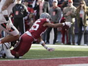 Washington State wide receiver Lincoln Victor, right, reaches for a touchdown while tackled by Oregon State defensive back Akili Arnold during the second half of an NCAA college football game against Oregon State, Saturday, Oct. 9, 2021, in Pullman, Wash.