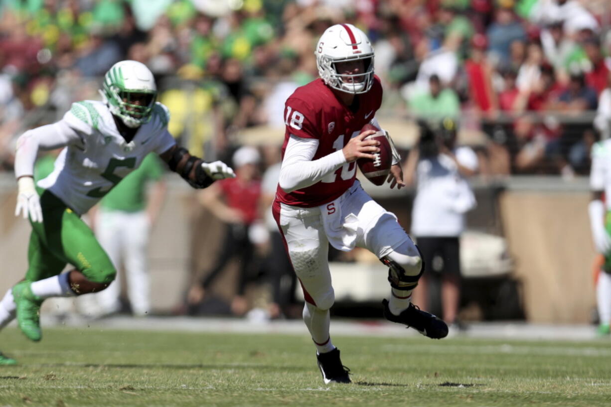 Stanford's Tanner McKee runs with the ball against Oregon during the first half of an NCAA college football game in Stanford, Calif., Saturday, Oct. 2, 2021.