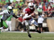 Stanford's Tanner McKee runs with the ball against Oregon during the first half of an NCAA college football game in Stanford, Calif., Saturday, Oct. 2, 2021.