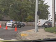 Police cars block the scene of a shooting involving Clark County sheriff's deputies that left an assault suspect dead.