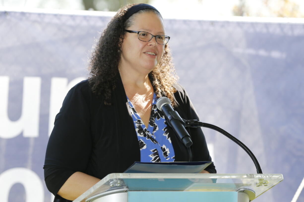 FILE - Annette Chambers-Smith, director of the Ohio Department of Rehabilitation and Correction, speaks in Columbus, Ohio. A growing number of state prison systems are outfitting guards with body-worn cameras even in environments already covered by thousands of stationary cameras. The George Bureau of Prisons piloted the concept last year and plans to outfit guards in two prisons this year and another two next year. Ohio tested the cameras at several prisons this year and is finalizing a contract. Chambers-Smith is the Ohio prisons director. She says the cameras can cover blind spots and also act as a preemptive tool against violence if inmates know they're being filmed.