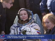 In this photo taken from video footage released by Roscosmos Space Agency, actress Yulia Peresild sits in a chair shortly after the landing of the Russian Soyuz MS-18 space capsule, southeast of the Kazakh town of Zhezkazgan, Kazakhstan, Sunday, Oct. 17, 2021. The Soyuz MS-18 capsule landed upright in the steppes of Kazakhstan on Sunday with cosmonaut Oleg Novitskiy, actress Yulia Peresild and film director Klim Shipenko aboard after a 3 1/2-hour trip from the International Space Station.