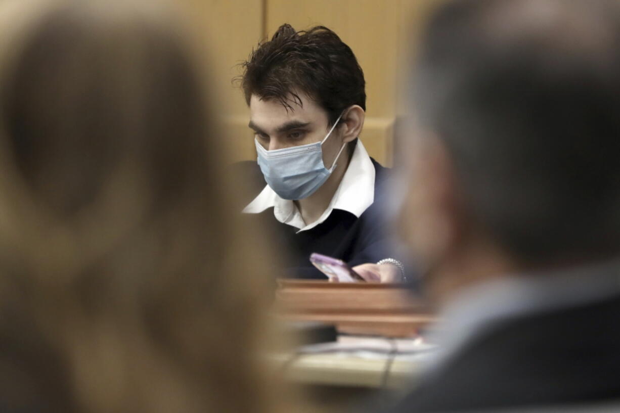 Parkland school shooter Nikolas Cruz is shown at the defense table at the Broward County Courthouse in Fort Lauderdale, Fla., on Monday, Oct. 4, 2021.