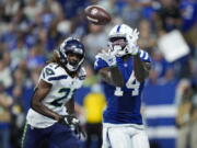 Indianapolis Colts wide receiver Zach Pascal (14) makes catch for a touchdown in front of Seattle Seahawks cornerback Tre Flowers (21) during the second half of an NFL football game in Indianapolis, Sunday, Sept. 12, 2021.