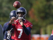 Seattle Seahawks backup quarterback Geno Smith (7) catches a ball during warmups before NFL football practice, Wednesday, Oct. 13, 2021, in Renton, Wash. Starting quarterback Russell Wilson had surgery on his hand last Friday, and Smith is expected to be the starting quarterback Sunday when the Seahawks play the Pittsburgh Steelers on the road. (AP Photo/Ted S.