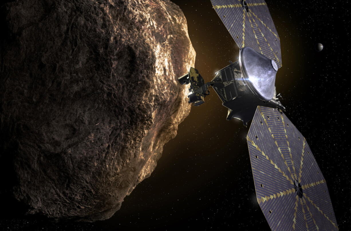 This image depicts the Lucy spacecraft approaching an asteroid. NASA reported Wednesday that one of the craft's two giant, circular solar panels is only between 75 percent and 95 percent extended. A lanyard is holding it in place.