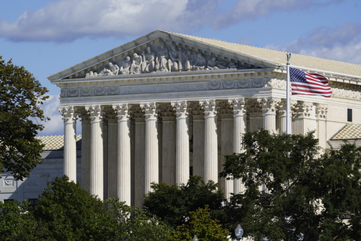 In this Oct. 18, 2021 photo, the Supreme Court is seen in Washington. Texas is urging the Supreme Court to leave in place its law banning most abortions and telling the justices there's no reason to rush into the case. The state filed its response Thursday to the Biden administration's call on the high court to block the law and rule conclusively this term on the measure's constitutionality.  (AP Photo/J.