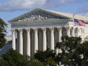 In this Oct. 18, 2021 photo, the Supreme Court is seen in Washington. Texas is urging the Supreme Court to leave in place its law banning most abortions and telling the justices there's no reason to rush into the case. The state filed its response Thursday to the Biden administration's call on the high court to block the law and rule conclusively this term on the measure's constitutionality.  (AP Photo/J.