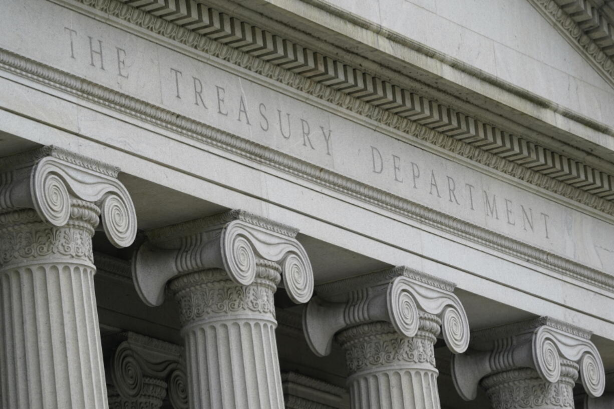 FILE - In this May 4, 2021, photo, the Treasury Building is viewed in Washington. The Treasury Department says that the economic and financial sanctions the United States has employed over the past two decades to battle global terrorism, nuclear proliferation, drug cartels and other threats need to adapt to a rapidly changing financial world. The department issued a report Monday, Oct. 18, 2021, that said it needs to modernize the technology it uses and upgrade its workforce to deal with new tools and techniques, such as digital currencies.