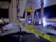 In this image made from video, debris from tornadoes pile around the pumps of a filling station late Sunday, Oct. 10, 2021, in Shawnee, Oklahoma. Several reported tornadoes ripped through Oklahoma late Sunday into early Monday morning, causing damage but no immediate word of deaths or injuries.