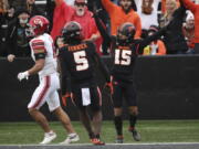 Oregon State wide receiver Anthony Gould (15) celebrates after scoring a touchdown during the first half of the team's NCAA college football game against Utah on Saturday, Oct. 23, 2021, in Corvallis, Ore.