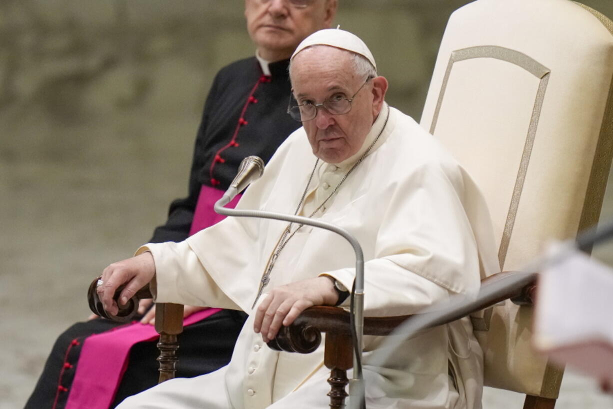 Pope Francis listens to speeches during his weekly general audience in the Pope Paul VI hall at the Vatican, Wednesday, Oct. 6, 2021.