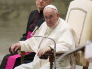 Pope Francis listens to speeches during his weekly general audience in the Pope Paul VI hall at the Vatican, Wednesday, Oct. 6, 2021.