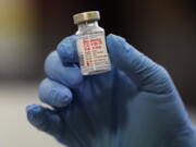 FILE - This Tuesday, Jan. 5, 2021 file photo shows a vial of the Moderna COVID-19 vaccine at a pop-up vaccine clinic in Salt Lake City. U.S. regulators expect to rule Wednesday, Oct. 20, 2021 on authorizing booster doses of the Moderna and Johnson & Johnson COVID-19 vaccines, a Food and Drug Administration official said at a government meeting.