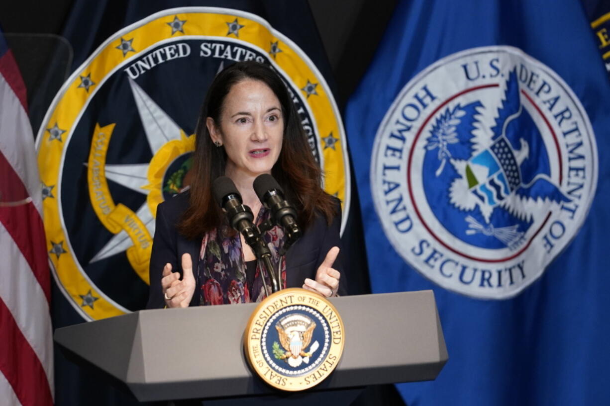 FILe - Director of National Intelligence Avril Haines introduces President Joe Biden during a visit to the Office of the Director of National Intelligence in McLean, Va., on July 27, 2021. U.S. intelligence agencies say they likely won't ever be able to conclude whether COVID-19 spread by animal-to-human transmission or leaked from a lab. The Director of National Intelligence issued a paper Friday, Oct. 29, that elaborates on findings released in August of a 90-day review ordered by Biden.