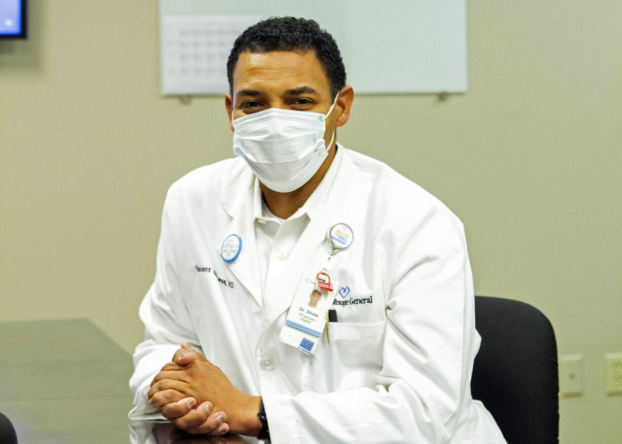 Dr. Vincent Shaw poses for a portrait in Baton Rouge, La., Wednesday, Sept. 29, 2021. He commonly hears patients tell him they haven't done enough research on the COVID-19 vaccines. Rest assured, he tells them, the vaccine developers have done their homework.