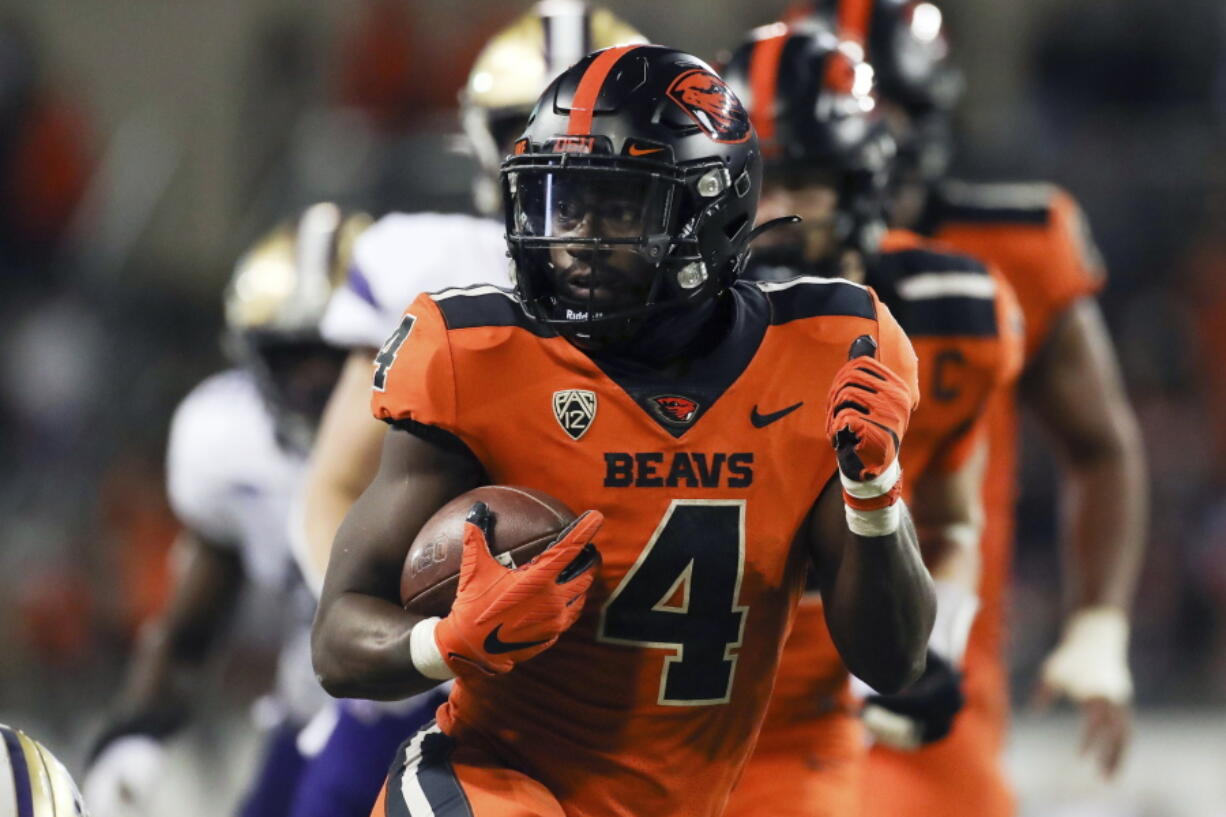 Oregon State running back B.J. Baylor (4) rushes for 27-yards to score a touchdown during the second half of an NCAA college football game against Washington on Saturday, Oct. 2, 2021, in Corvallis, Ore. Oregon State won 27-24.