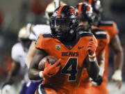 Oregon State running back B.J. Baylor (4) rushes for 27-yards to score a touchdown during the second half of an NCAA college football game against Washington on Saturday, Oct. 2, 2021, in Corvallis, Ore. Oregon State won 27-24.