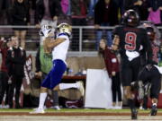 Washington wide receiver Jalen McMillan, left, catches a touchdown pass against Stanford during the fourth quarter of an NCAA college football game in Stanford, Calif., Saturday, Oct. 30, 2021. Washington won 20-13.