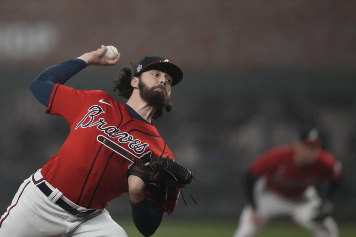 Atlanta Braves starting pitcher Ian Anderson throws during the first inning in Game 3 of baseball's World Series between the Houston Astros and the Atlanta Braves Friday, Oct. 29, 2021, in Atlanta. (AP Photo/David J.