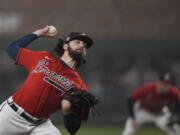 Atlanta Braves starting pitcher Ian Anderson throws during the first inning in Game 3 of baseball's World Series between the Houston Astros and the Atlanta Braves Friday, Oct. 29, 2021, in Atlanta. (AP Photo/David J.