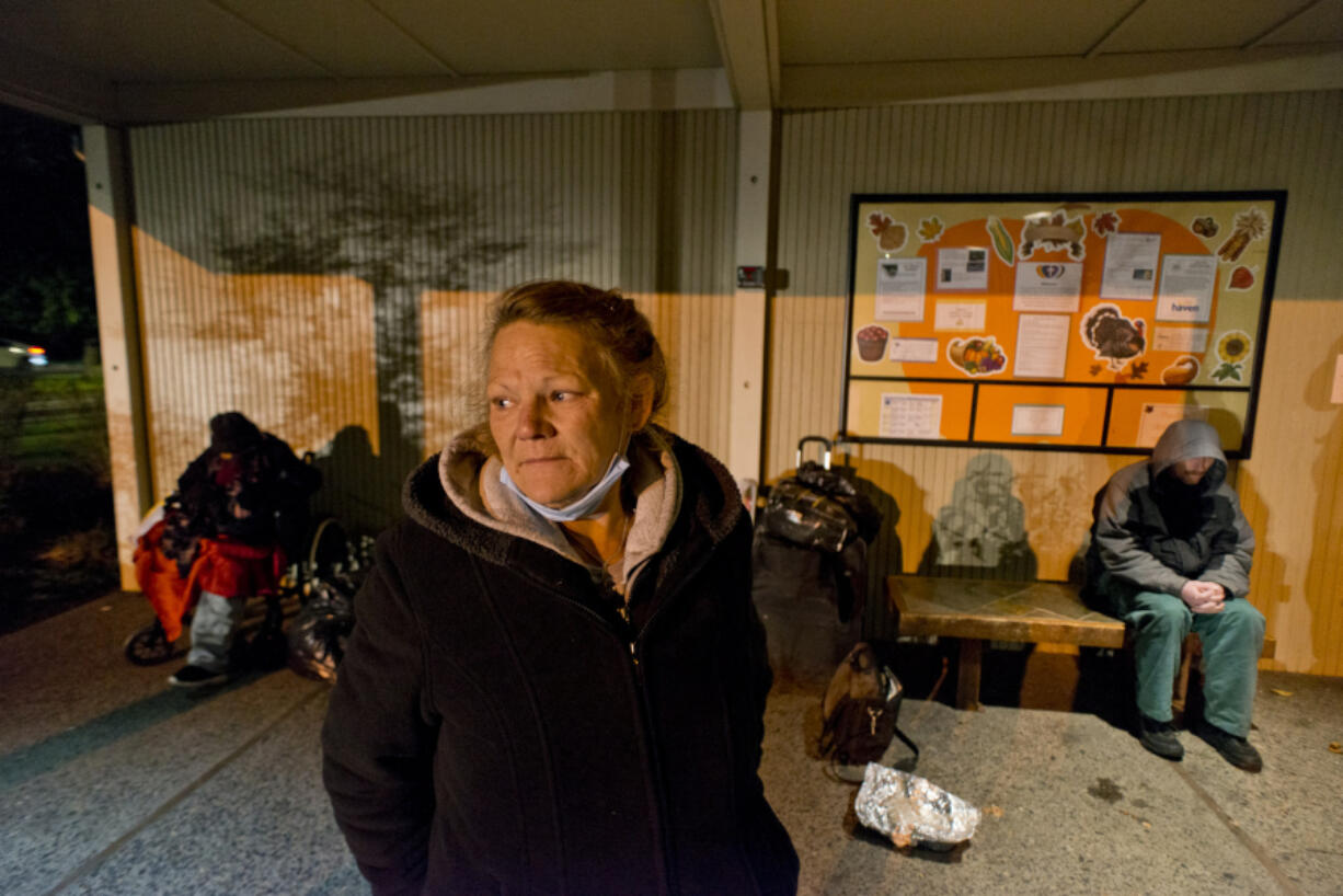 Shelter client Tonya Johnson waits for the Satellite Overflow Shelter at Immanuel Lutheran Church to open on Nov. 19. Johnson grew up in Clark County. She attended Battle Ground High School and Clark College and was a special education teacher for more than 20 years. But a series of tragic events left her without a safety net. She's been living on the streets since August.