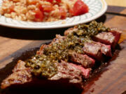 Churrasco Steak with Chimichurri Sauce and Rice and Tomatoes.