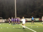 Columbia River players celebrate Anna Iniguez’s goal in the 50th minute of their state playoff game Wednesday against White River.