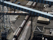 A train moves past United Grain at the Port of Vancouver.  Railroad companies have raised their rates twice in the past year, adding to the rising cost of business at United Grain.