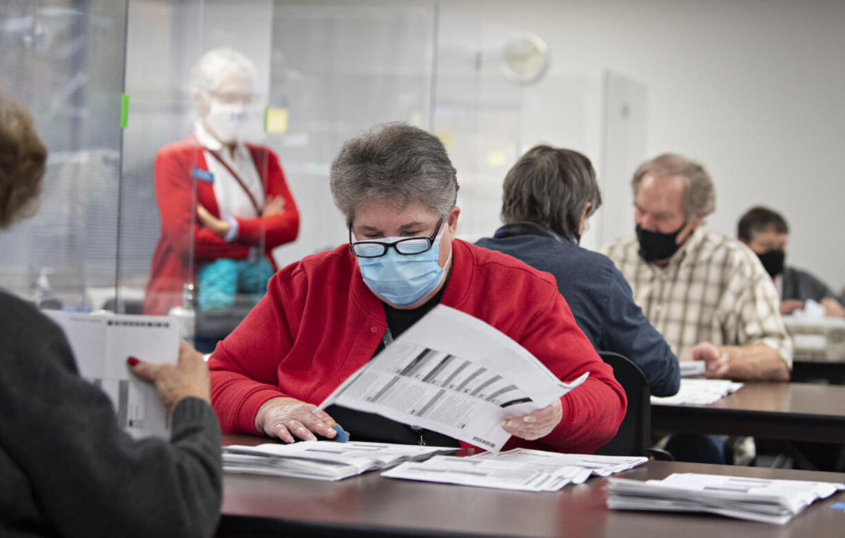 Ballot inspector Charlene Gaul manually counts ballots at the Clark County Elections Office on Wednesday morning. The elections office performed a manual count of 600 ballots to ensure election integrity.