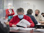 Ballot inspector Charlene Gaul manually counts ballots at the Clark County Elections Office on Wednesday morning. The elections office performed a manual count of 600 ballots to ensure election integrity.