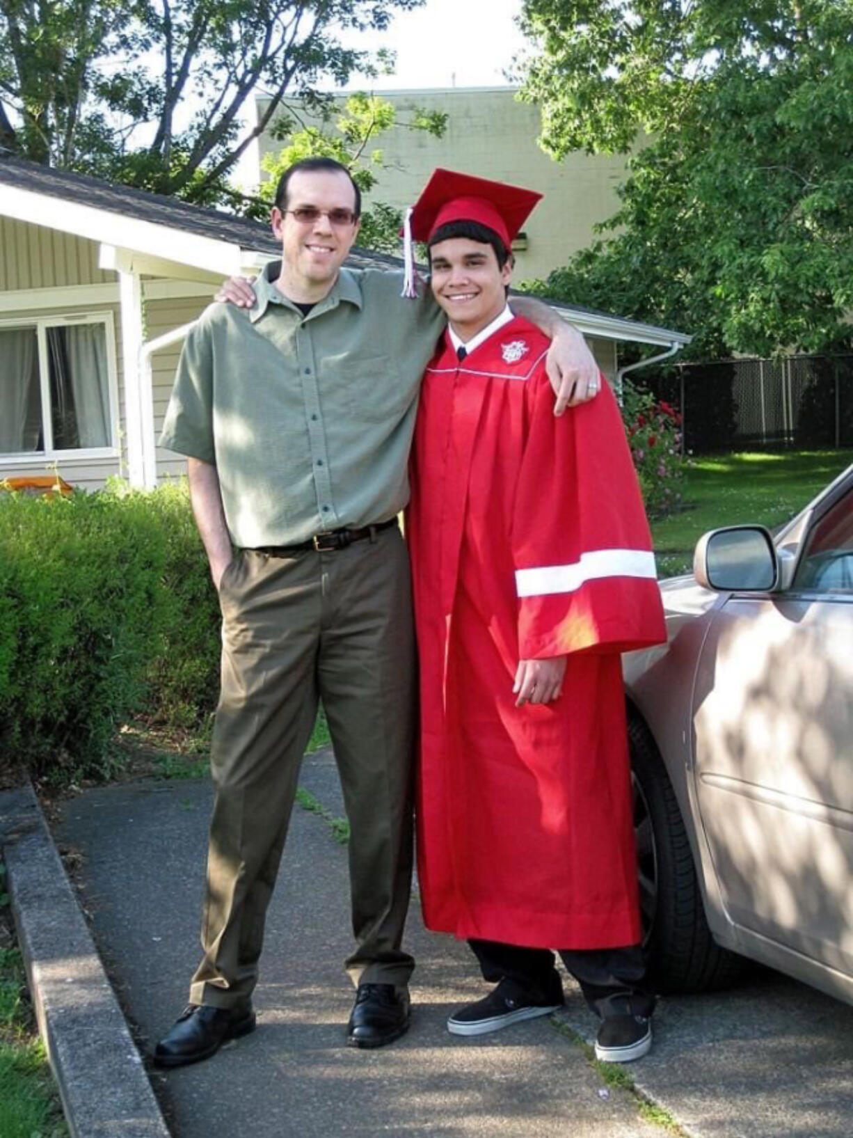 Damien Wheeler and his longtime friend and mentor, Shawn Hamburg, celebrate Wheeler's graduation together.