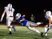 Mountain View's CJ Hamblin leaps in an attempt to make a touchdown-saving tackle of Seattle Prep's Austin Harnetiaux in a 3A State preliminary game on Saturday, Nov. 6, 2021, at McKenzie Stadium. Seattle Prep defeated Mountain View 38-27 to end the Thunder season.