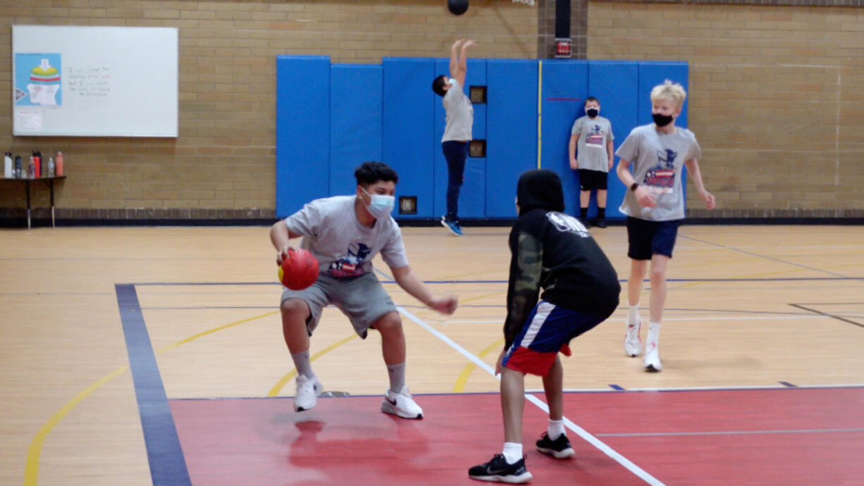 Students at Pleasant Valley Middle School play a game they made up as part of their physical education class.