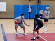 Students at Pleasant Valley Middle School play a game they made up as part of their physical education class.