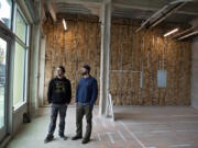 Ruse Brewing co-founders Shaun Kalis, left, and Devin Benware stand in the future bar area of their new pizza venture, Crust Collective, at The Waterfront Vancouver. It will feature their take on Detroit-style pizza.