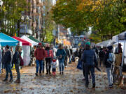 People stroll through the Vancouver Farmers Market on Saturday. This weekend kicked off the fall market with about 20 new vendors.