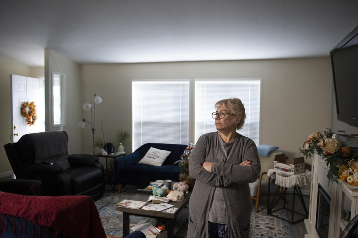 Kimberly Erkenbrack holds a notice of the rent increase. There was one moment that struck her particularly hard: A unknown neighbor walked up while Erkenbrack was in her driveway, and she asked for boxes because she needed to move out. She couldn't afford to live there any more. "It was an old woman I didn't know," she said.