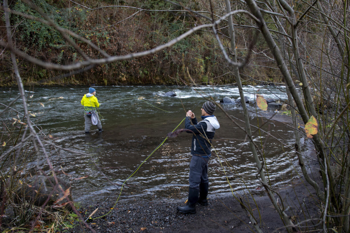 Hood River fishermen Eli Schroppel, left, and Matt Sweeting hope to get a bite as they fish in the White Salmon River.