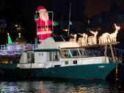 Contributed by Christmas Ships 
 Santa drives his reindeer along the Columbia River as part of the annual Christmas Ships parade, which returns this month. (Contributed by Christmas Ships)