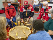 The Traveling Day Society plays a song Tuesday at Lincoln Elementary School. The intertribal Native American group performed as part of a virtual assembly for Lincoln students in advance of the Thanksgiving holiday.