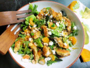 This warm arugula salad delivers a satisfying mix of pan-fried chicken tenders, fresh orange, olives and goat cheese in a warm citrus dressing, with a toasted almond garnish for crunch.