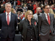 Portland Trail Blazers owner Jody Allen, center, with general manager Neil Olshey, left, and president Chris McGowan, right, at a game in 2019. McGowan stepped down from his position on Friday, November 12, 2021, after nine years in the position.