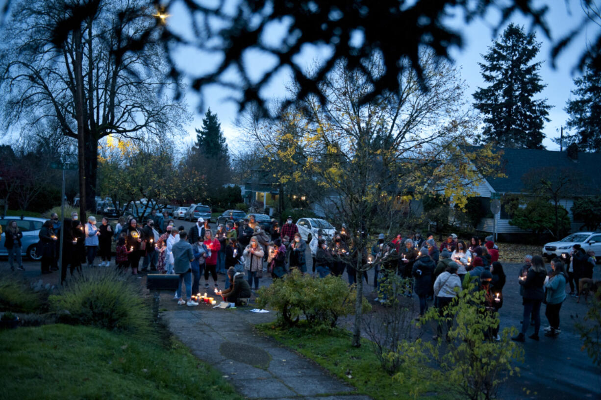 Friends and neighbors of Monica "Star" Murrah, whose estranged husband is accused of killing her, hold a candlelight vigil Sunday in the Arnada neighborhood.