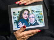 Helena Apothaker holds a photograph of her and her mother, Catherine, in West Hollywood. Apothaker is suing Silverado Senior Living after her mom died of COVID-19 at a care facility near Los Angeles' Fairfax District.