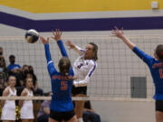 Columbia River?s Rylie Reeves hits it past the block of Ridgefield?s Natalie Andrew during a 2A Greater St. Helens League volleyball match on Tuesday, Sept. 21, 2021, at Columbia River High School. Ridgefield won 3-0.