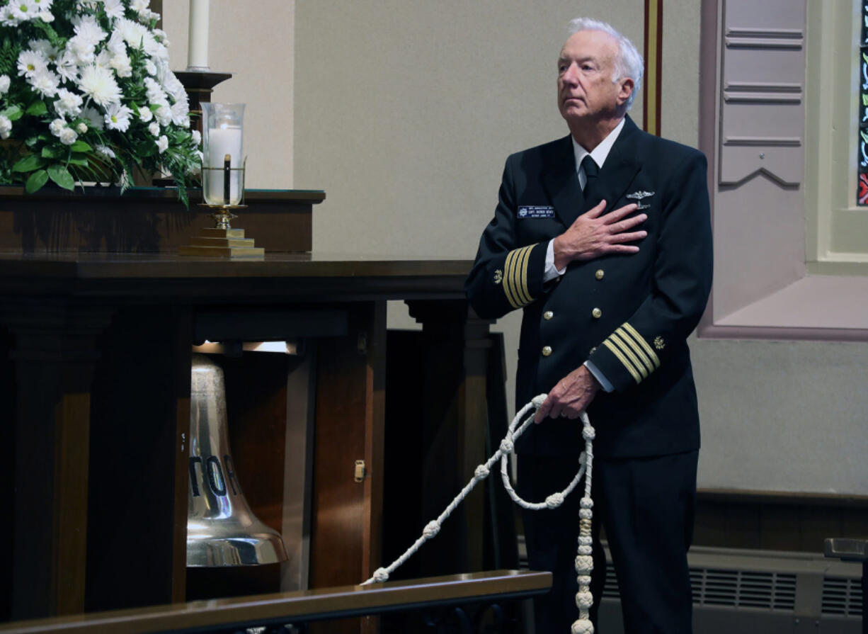 Captan Patrick Beard rings the Octorara and Brotherhood Bell on Sunday during the Great Lakes Memorial Service at Mariner's Church. The memorial service remembers the lives lost in the roughly 6,000 shipwrecks in lakes Superior, Michigan, Huron, Erie and Ontario. (Kirthmon F.