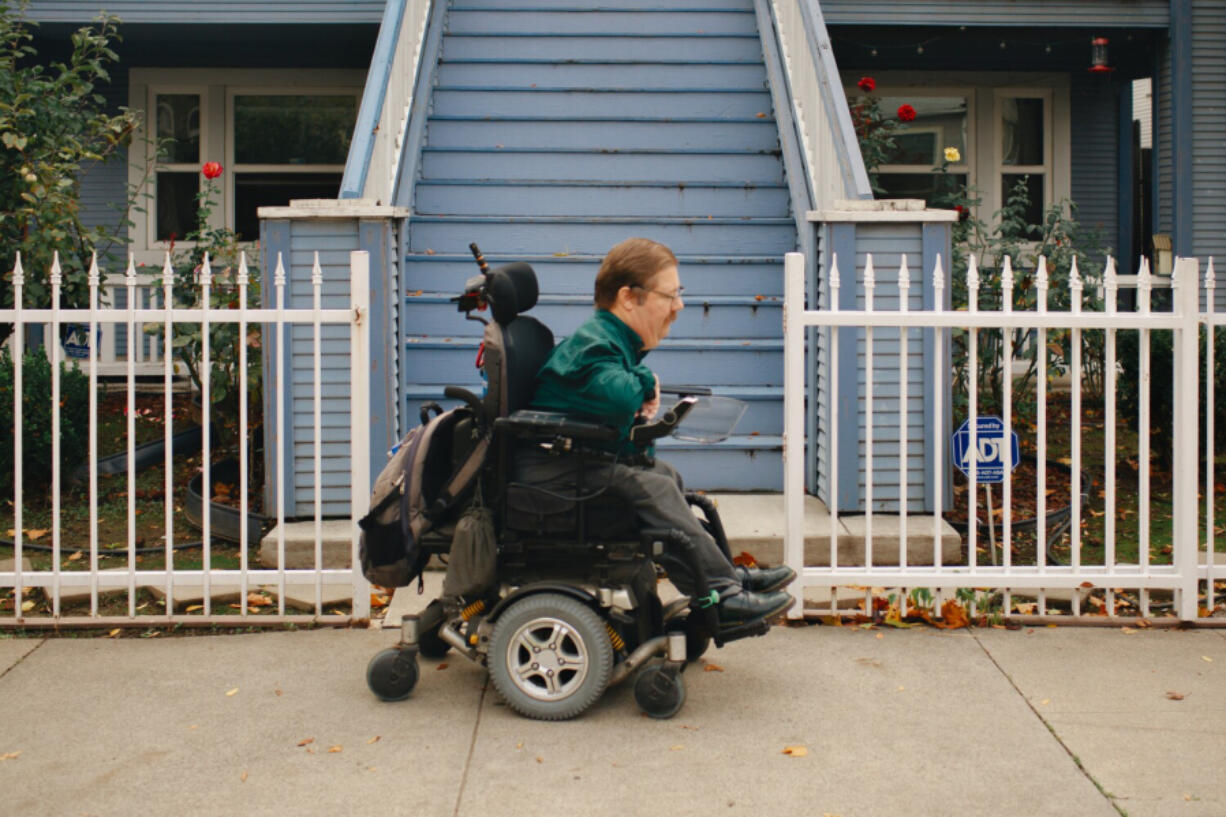 SACRAMENTO, CA - NOVEMBER 10: Russell Rawlings, rides down his treelined street in his wheelchair on Wednesday, Nov. 10, 2021 in Sacramento, CA. Rawlings a plaintiff in a lawsuit argues that failing to effectively cover the cost wheelchairs is discriminatory against disabled people. Rawlings said his wheelchair and a tilt option to prevent pressure sores costs roughly 0,000 - well above the ,000 annual limit in the Kaiser plan he obtained through his employer, according to the lawsuit.