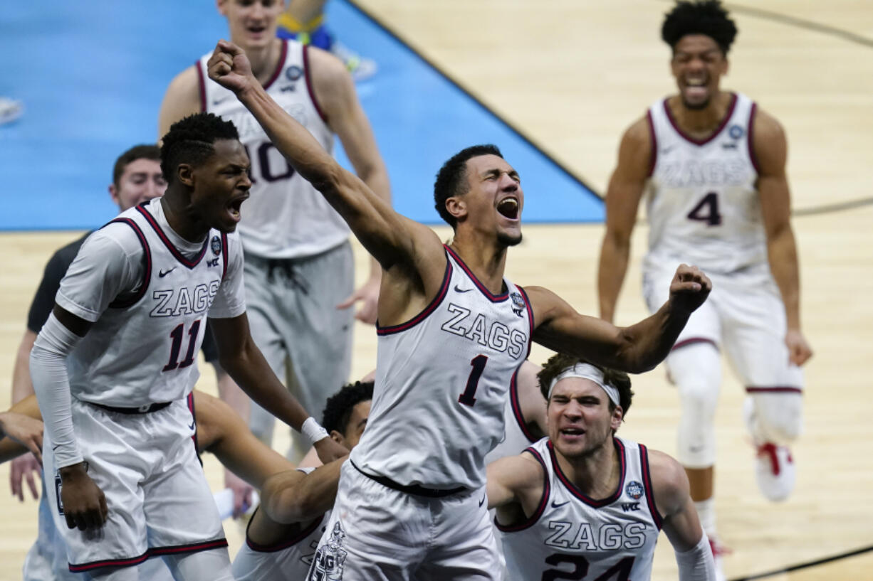 Gonzaga guard Jalen Suggs (1) celebrates making a 40-foot game-winning basket against UCLA during overtime in a Final Four semifinal game in Indianapolis.